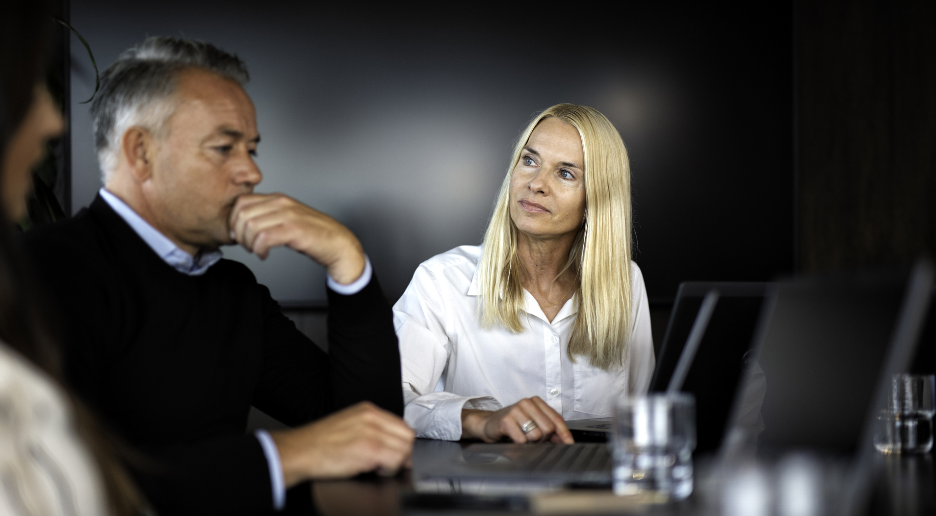 Uncertain engineer in discussion meeting with employer before a possible dismissal in a downsizing NITO