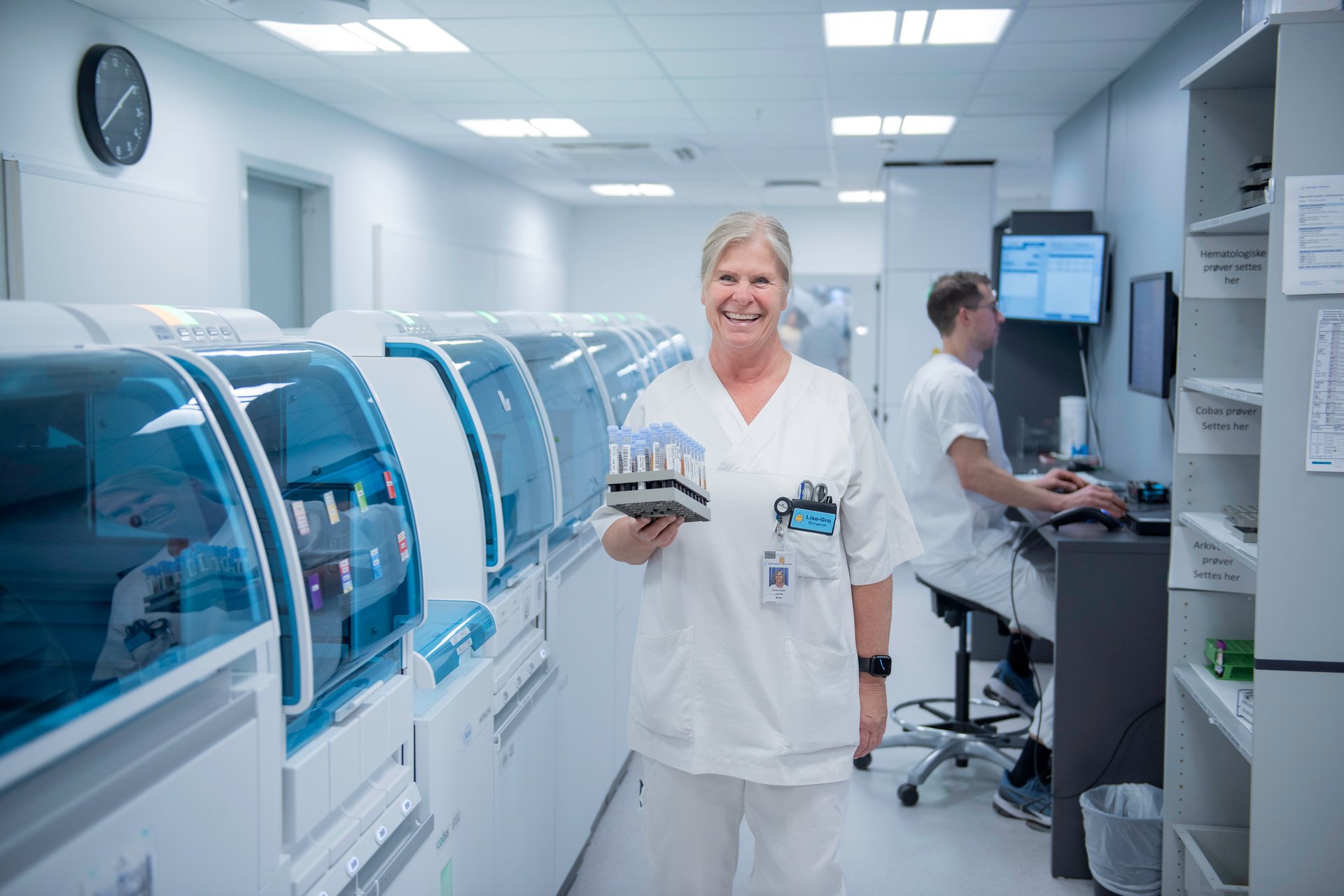 Female NITO member smiling at work as a bioengineer in the lab.