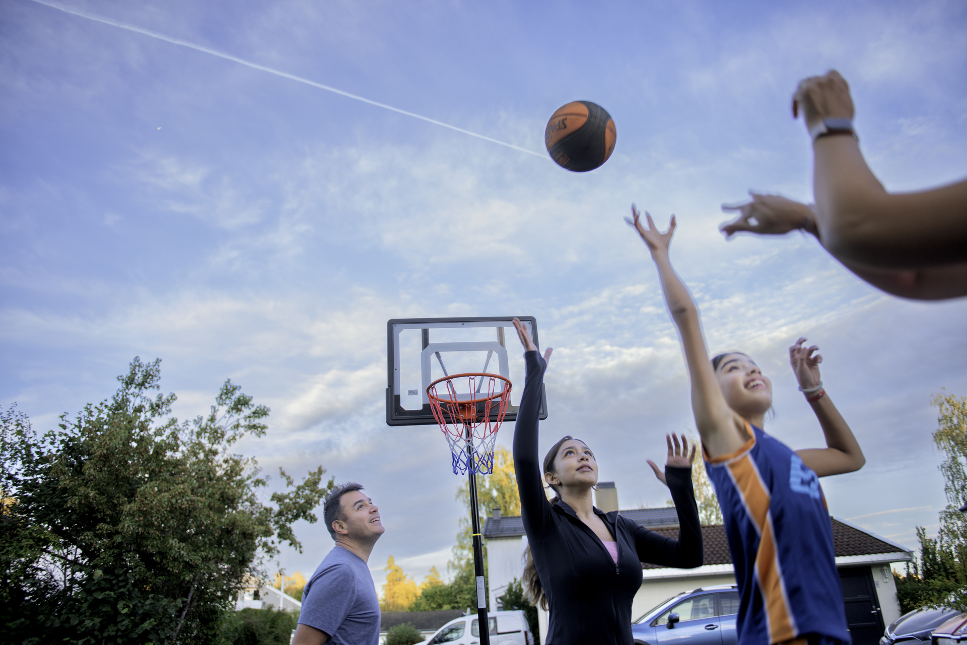 Family playing basketball