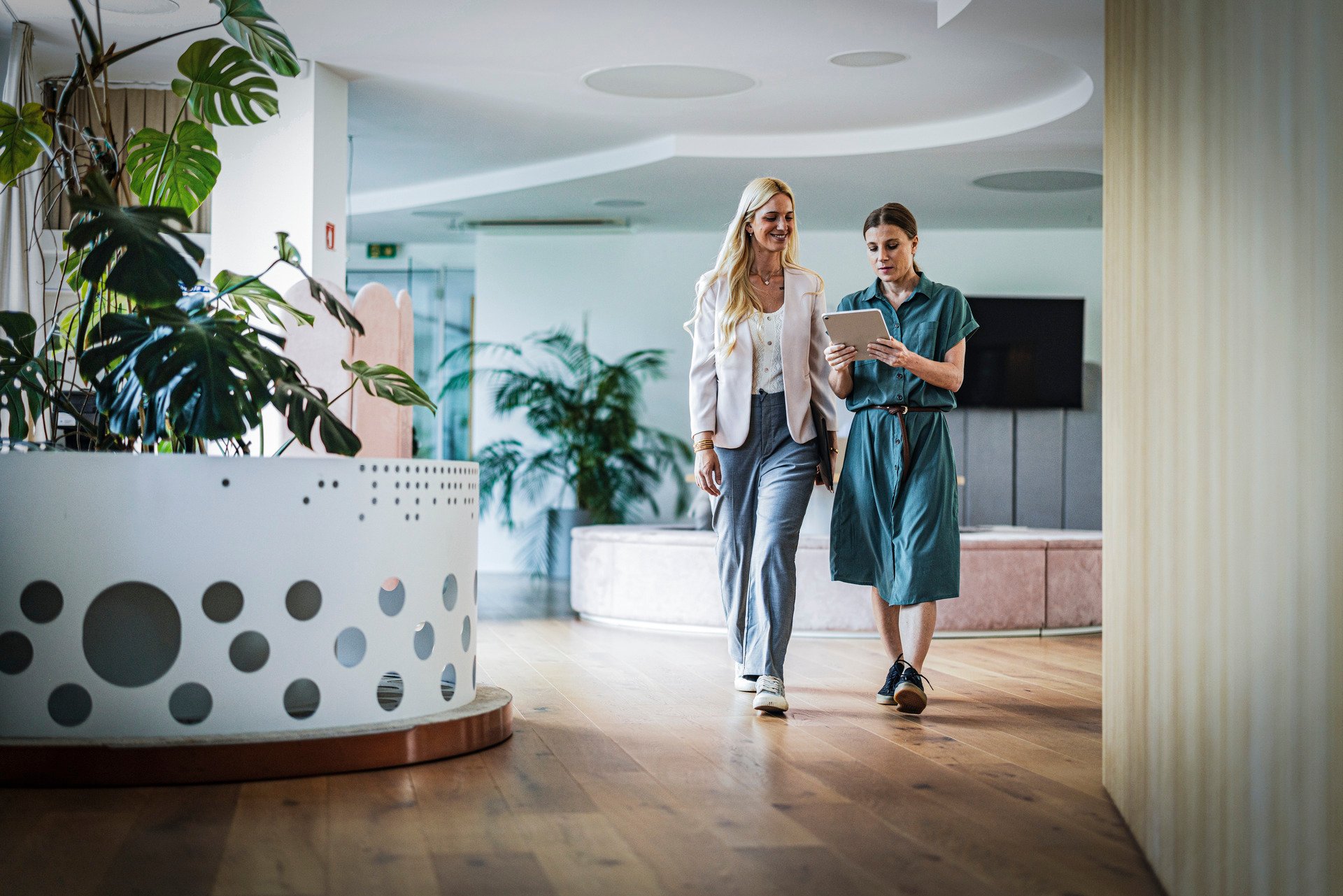Two ladies walking and talking together